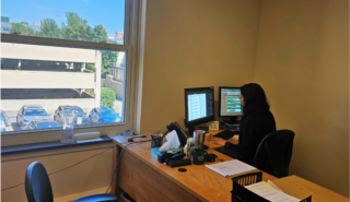 Pragya sitting at desk